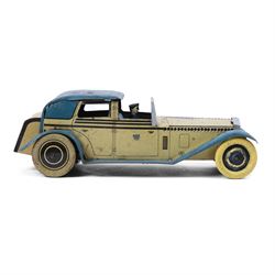 Wells tinplate clockwork limousine, the cream body, with blue roof and lithographed details, with driver and key, H8cm, L23cm