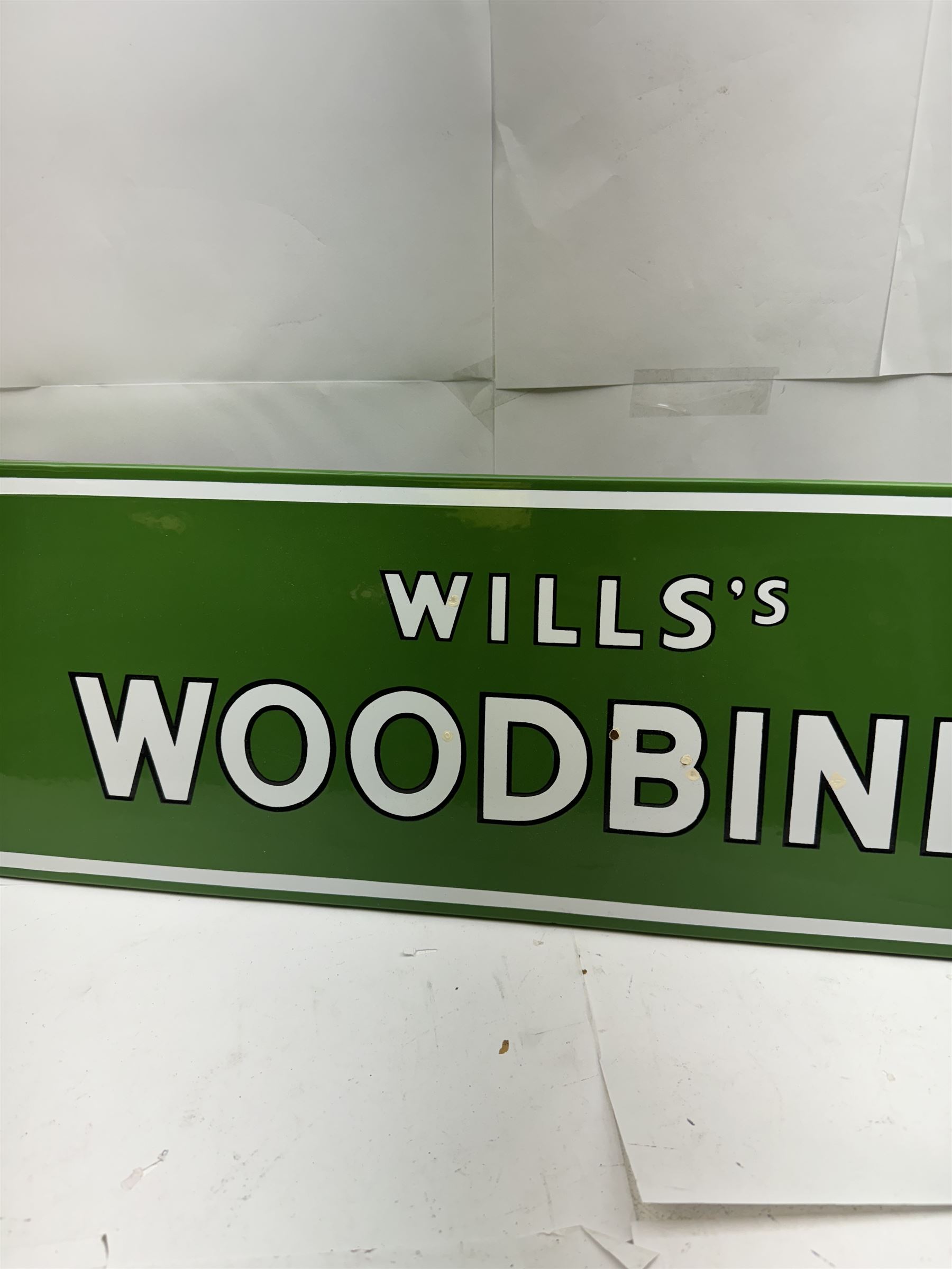 Wills's Woodbine enamel advertising sign, with white and black lettering on a green ground, W73.5cm, H23cm