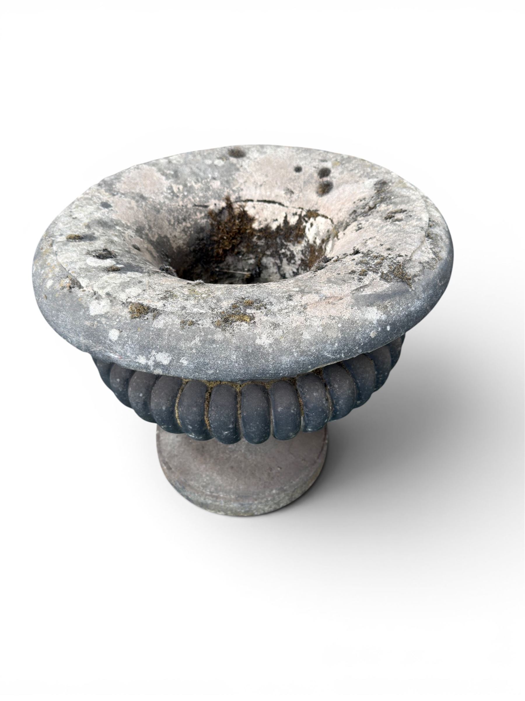 Carved sandstone garden urn, gadrooned campana form