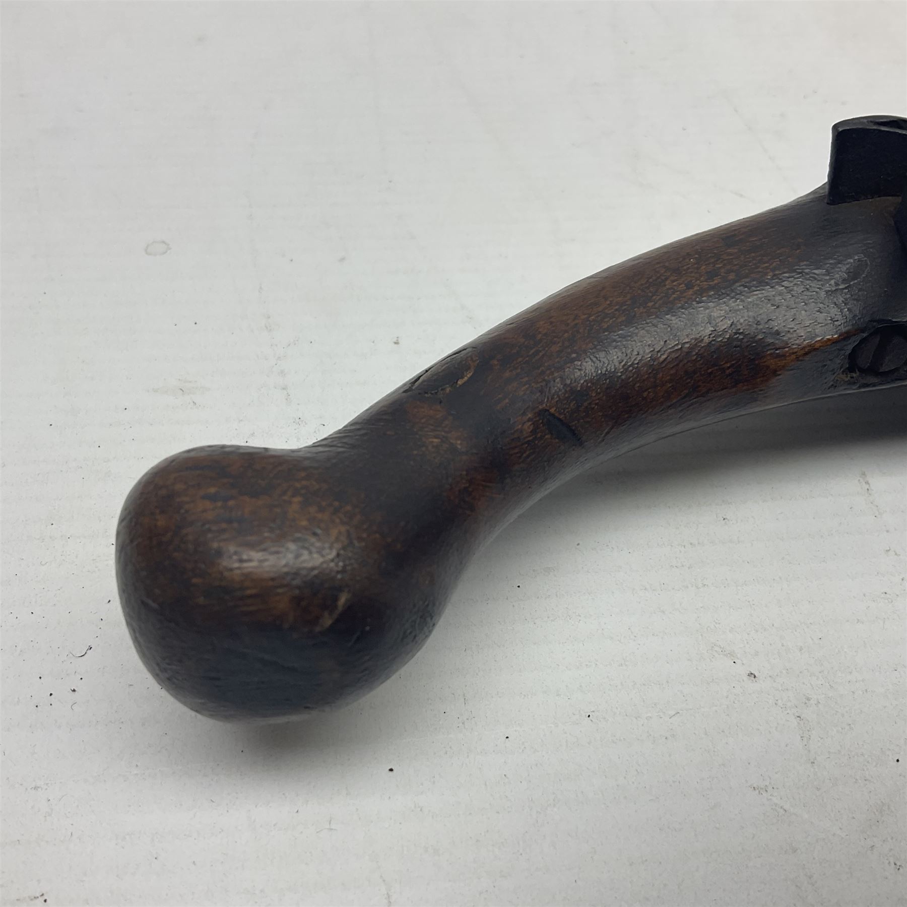 Late 18th/early 19th century flintlock tinder lighter, the steel box lock with hinged door to the left side, fruitwood butt with plain bar trigger, the left side set with a taper sconce and bipod front support, L21cm.