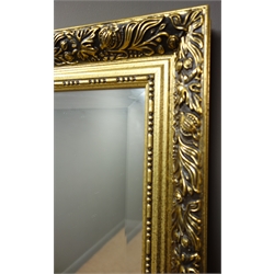  Gilt framed arch top bevel edged over mantle mirror (W104cm, H74cm) and a gilt framed bevel edged rectangular wall mirror.  