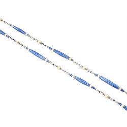 Early 20th century platinum enamel and pearl necklace, sixteen guillioche blue enamel and white enamel baton links, each spaced by a trace links and a single seed pearl