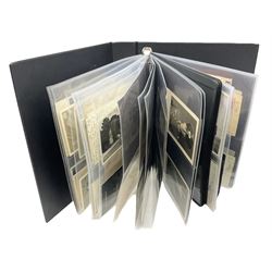 Modern loose leaf album of WW2 German postcards, photographs and other paper ephemera including Adolf Hitler, Luftwaffe, comic, soldier and group portraits, memorial cards, propaganda images, interesting postmarks etc