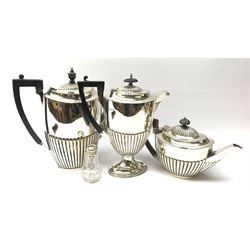 Walker & Hall silver-plated pedestal hot water pot of half fluted form, a matching coffee pot and teapot, together with a cut glass and silver mounted pepper pot 