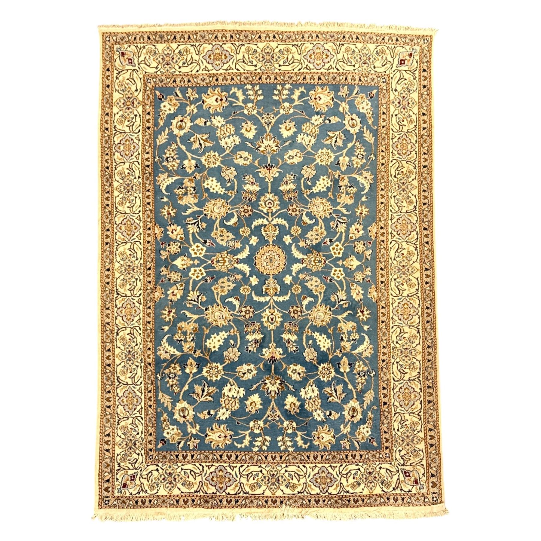 Central Persian Kashan rug, densely knotted, in a teal and cream ground, central medallion with circular rosette surrounded by a highly detailed field of radiating palmettes, vine arabesque patterns, rosettes, and  lotus blossoms, main border with alternating palmettes flanked by two narrower guard borders with a repeating floral meander design 