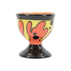 Lorna Bailey ceramics, including Oldcourt Ware jug, Bauhaus pattern wall pocket, cat figure and egg cup, all decorated in black, red, yellow and orange abstract patterns, wall pocket H18cm
