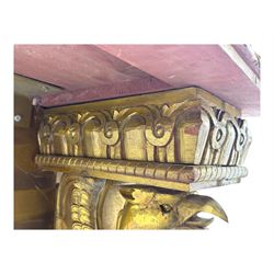 19th century Renaissance Revival carved and giltwood centre table, the rectangular top with gadrooned edge and carved frieze of repeating arched motifs with stylised scrolls, supported by a pair of carved winged griffin supports restrained by a central chained figure, on stepped rectangular bases united by carved stretcher