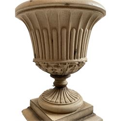 Leeds Fire Clay - 19th century garden urn on plinth, moulded rim over stop-fluted body and acanthus leaf underbelly, moulded footed base, the plinth with moulded upper edge over acanthus leaves, moulded base 