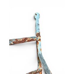 Regency period wrought iron strapwork garden bench, cresting rail with central Scottish thistle motif and flanking pediments, in distressed blue painted finish