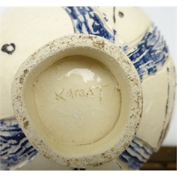  Stoneware globular footed pitcher/ vase, decorated in relief with three figures on textured ground, signed KareaT? and stylized fish platter produced for Department 56, L48cm   