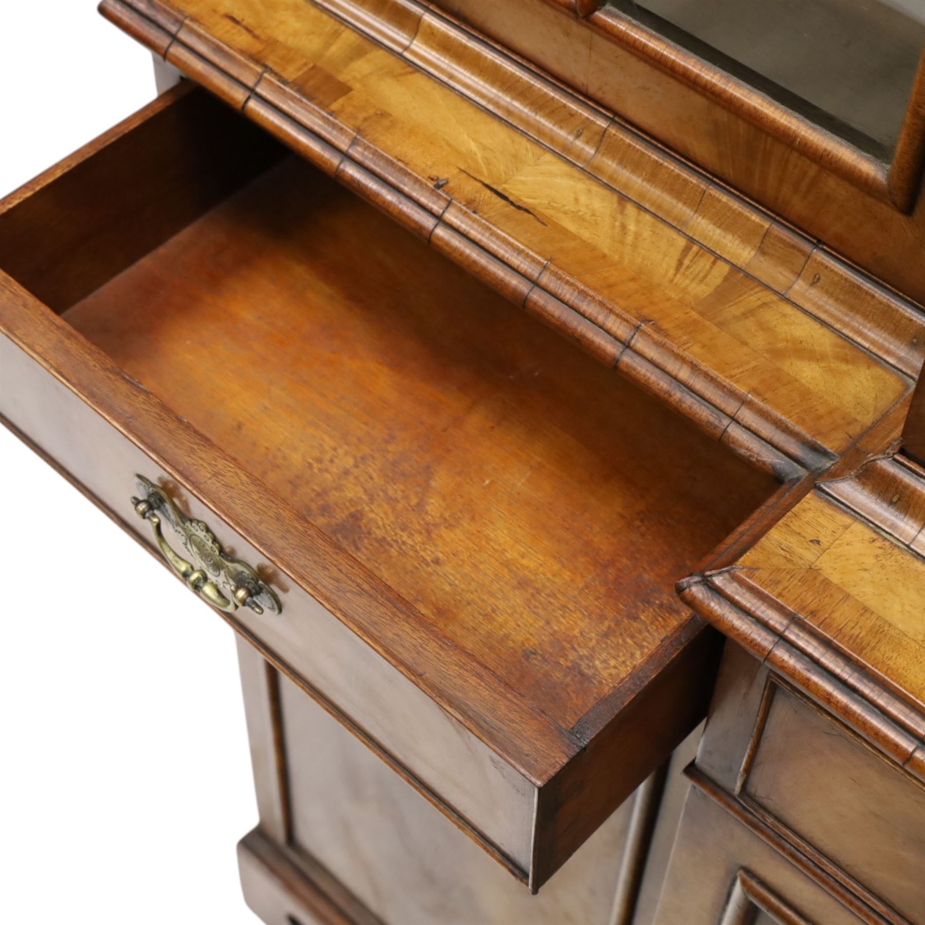 Georgian design mahogany breakfront bookcase on cupboard, projecting cornice over four arched astragal glazed doors, base fitted with three drawers over panelled cupboards, raised on bracket feet