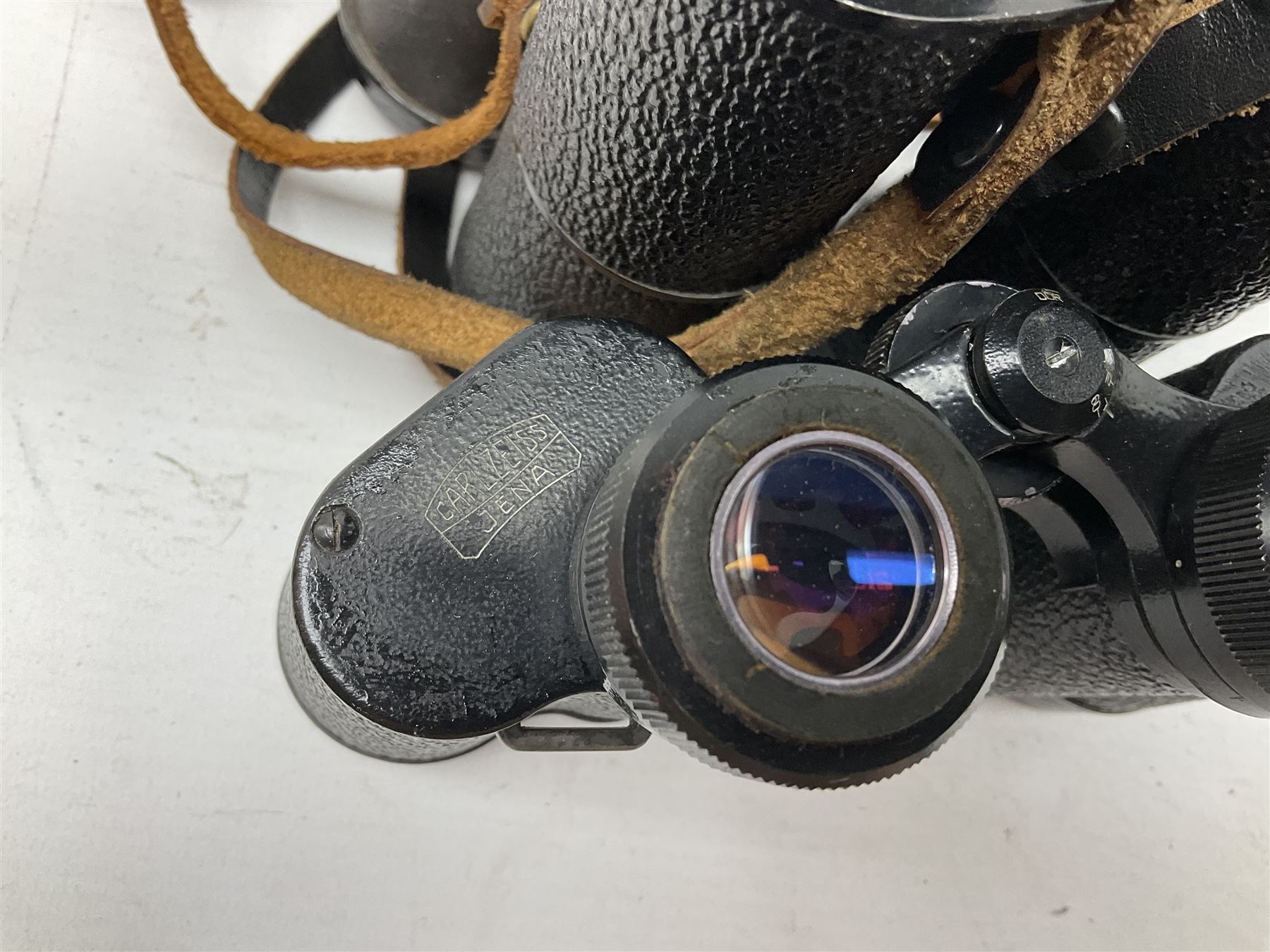 Twelve pairs of binoculars to include BWCF 7x35 Extra Wide Angle, Carl Zeiss Jena Delturis 8x24, Carl Zeiss Jena Jenoptem 8x30W, Chinon Countryman 10x50,  Ajax 8x30, Regent 16x50, etc,  some with cases