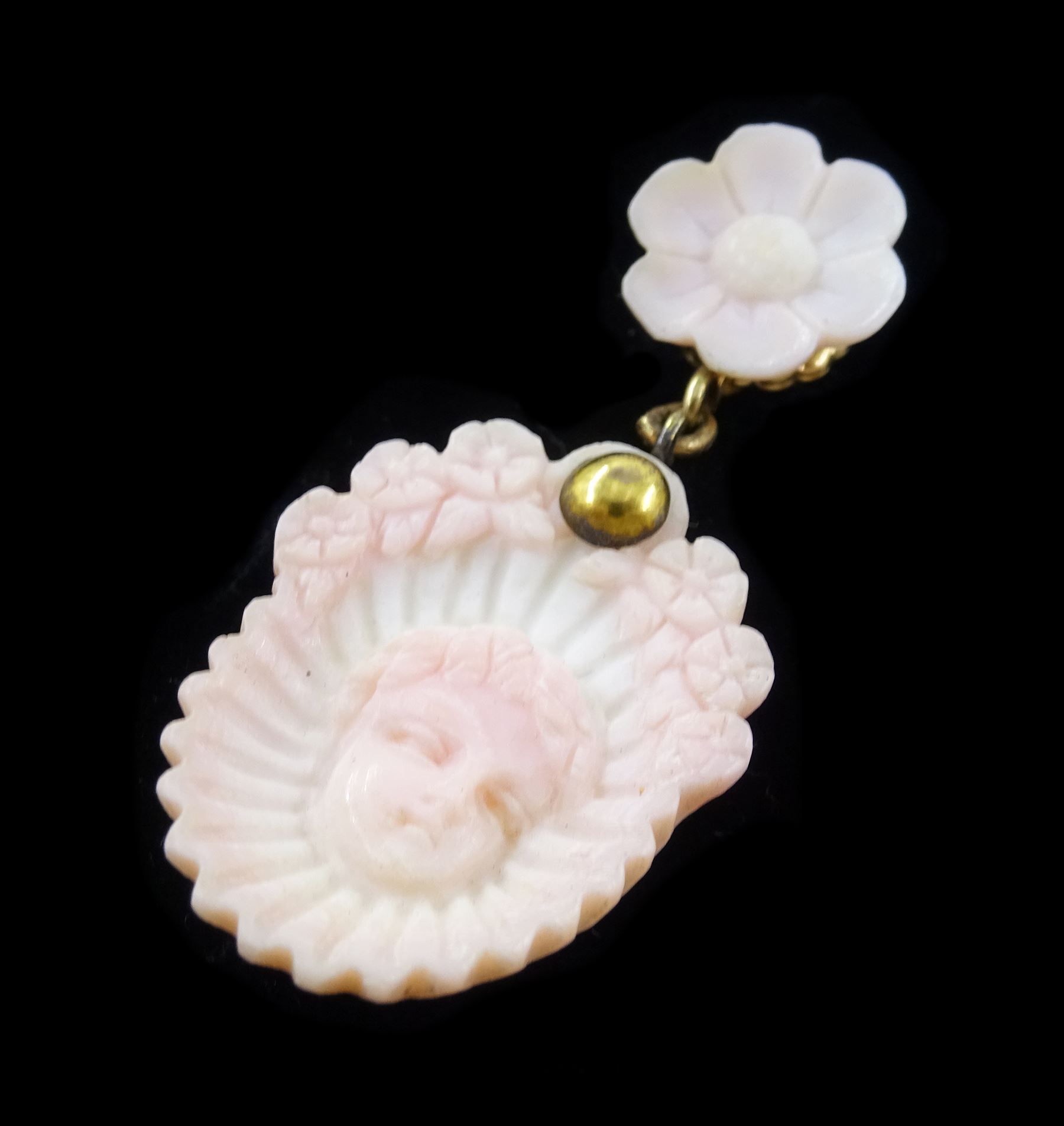 19th century gold conch shell pendant / brooch and matching earrings, each with carved bust shell of a cherub / child and flower head decoration, the earrings suspending a further flower head stud