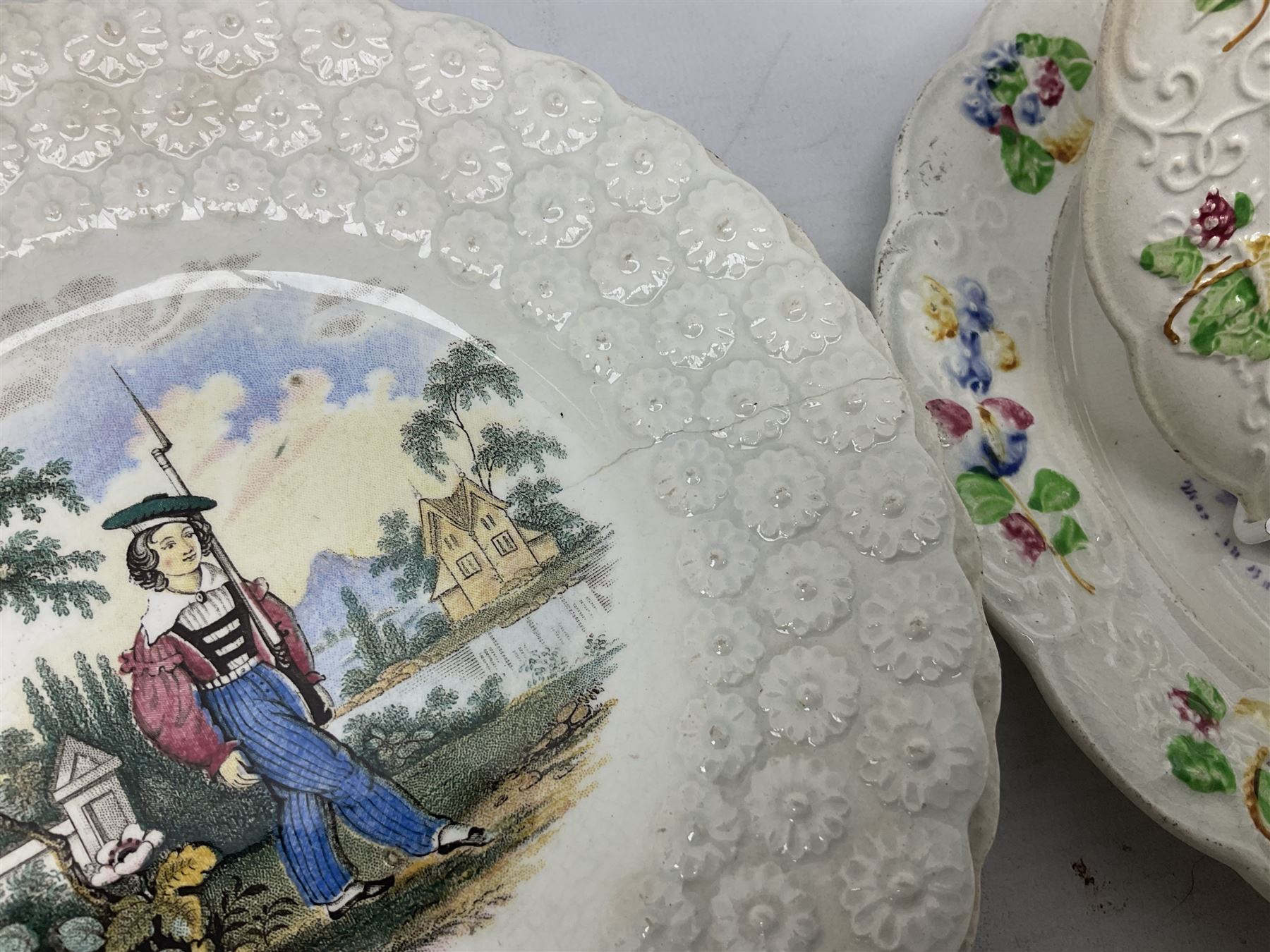 Collection of 19th century William Smith & Co nursery plates, to include examples decorated in the pastime series, and similar, all with moulded floral borders