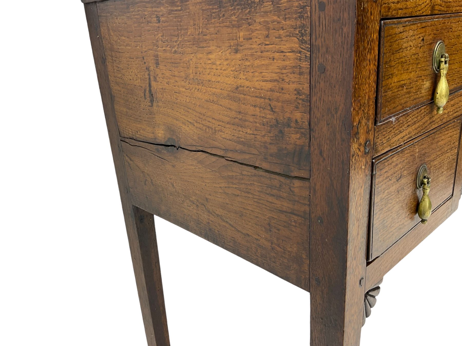 18th century Welsh oak lowboy, fitted with long drawer above three small drawers, square tapering supports, with fan carved corner brackets, circular plate and drop handles 