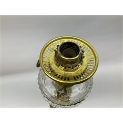 Victorian brass oil lamp, the square stepped base leading to a Corinthian column supporting a part slice cut clear glass reservoir, burner, clear glass chimney and foliate etched glass shade with amber rim, overall H80cm