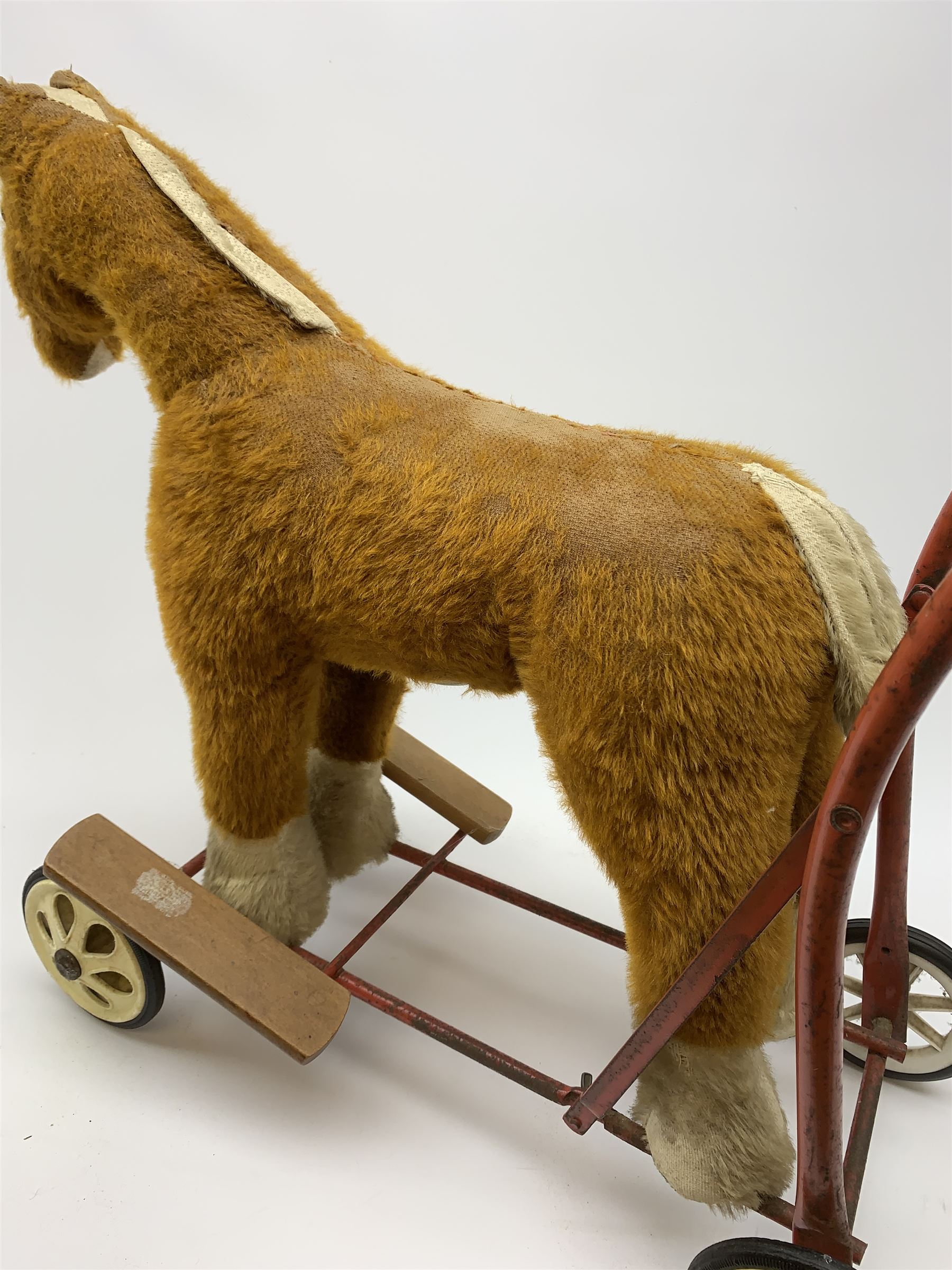 Pedigree push along plush covered horse 1950s-60s with red tubular metal framework and beech foot rests H25