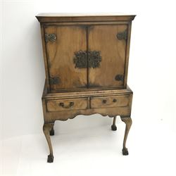 Georgian style walnut cocktail cabinet on stand, two cupboards enclosing glazed shelf above two drawers, cabriole legs on ball and claw feet, W84cm, H137cm, D48cm