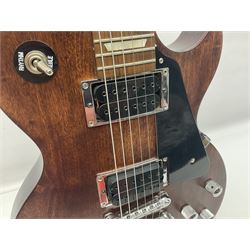 2012 American Gibson Les Paul Studio electric guitar, retro fitted with iron gear pick-ups, push-pull 'pots', roller bridge, string butler and locking machines, serial no.115321594, L99cm overall; in Gibson soft carrying case.