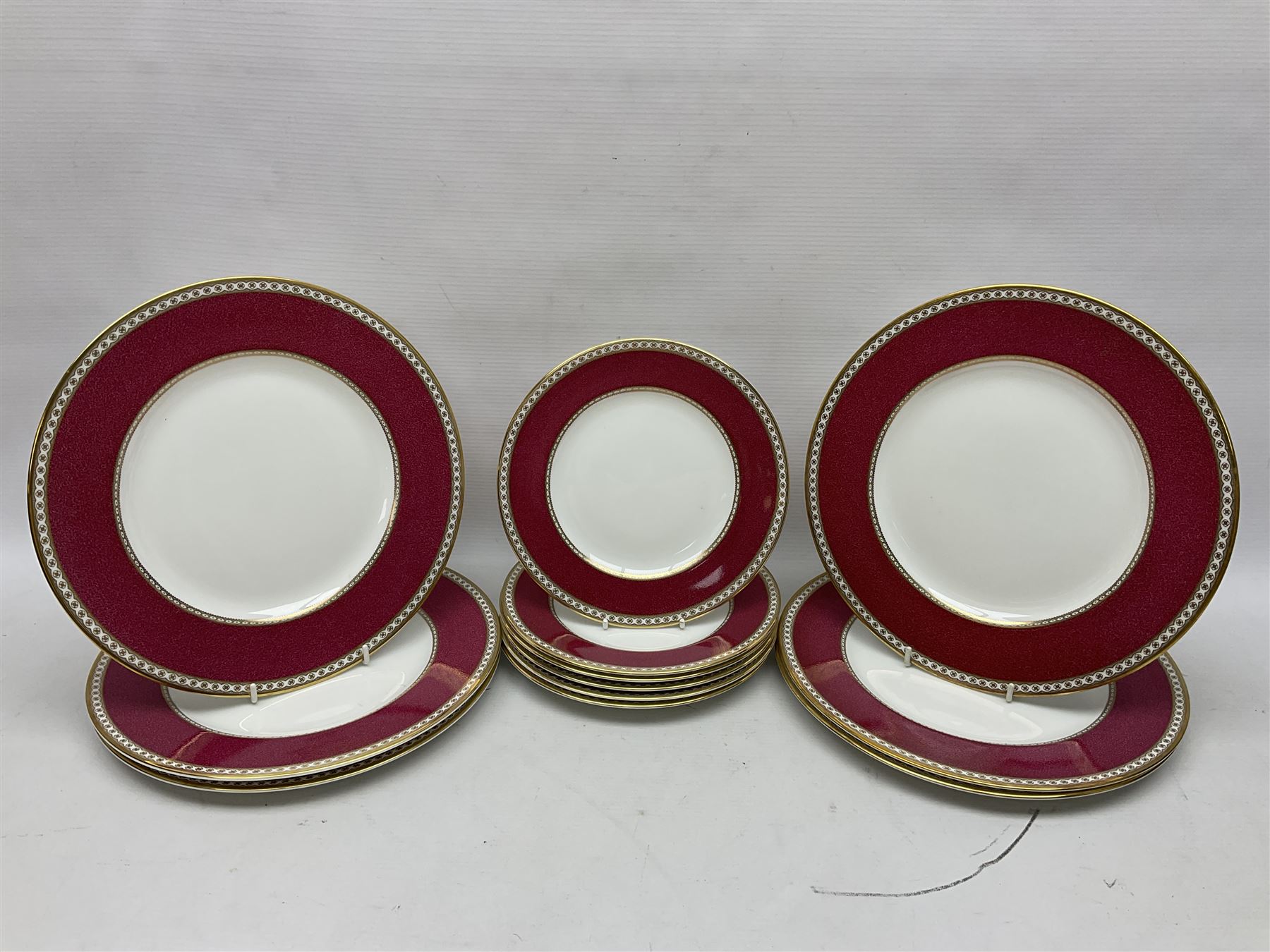 Wedgwood Ulander powder ruby pattern part dinner service, comprising six dinner plates, six side plates, six dessert plates, six soup bowls and sauce boat