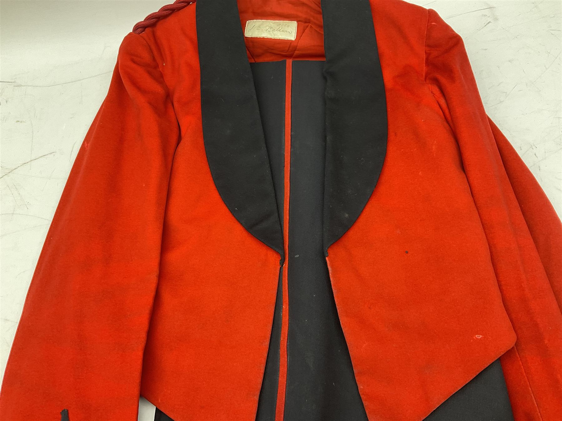 Royal Military College Sandhurst parade uniform with peaked cap and two-piece mess dress, all bearing historic manuscript labels for J.E.A. Baldwin, possibly Air Marshal Sir John Eustace Arthur Baldwin (1892-1975) who served in the British Army 1910-18 & 1944-58 and in the RAF 1918-44.