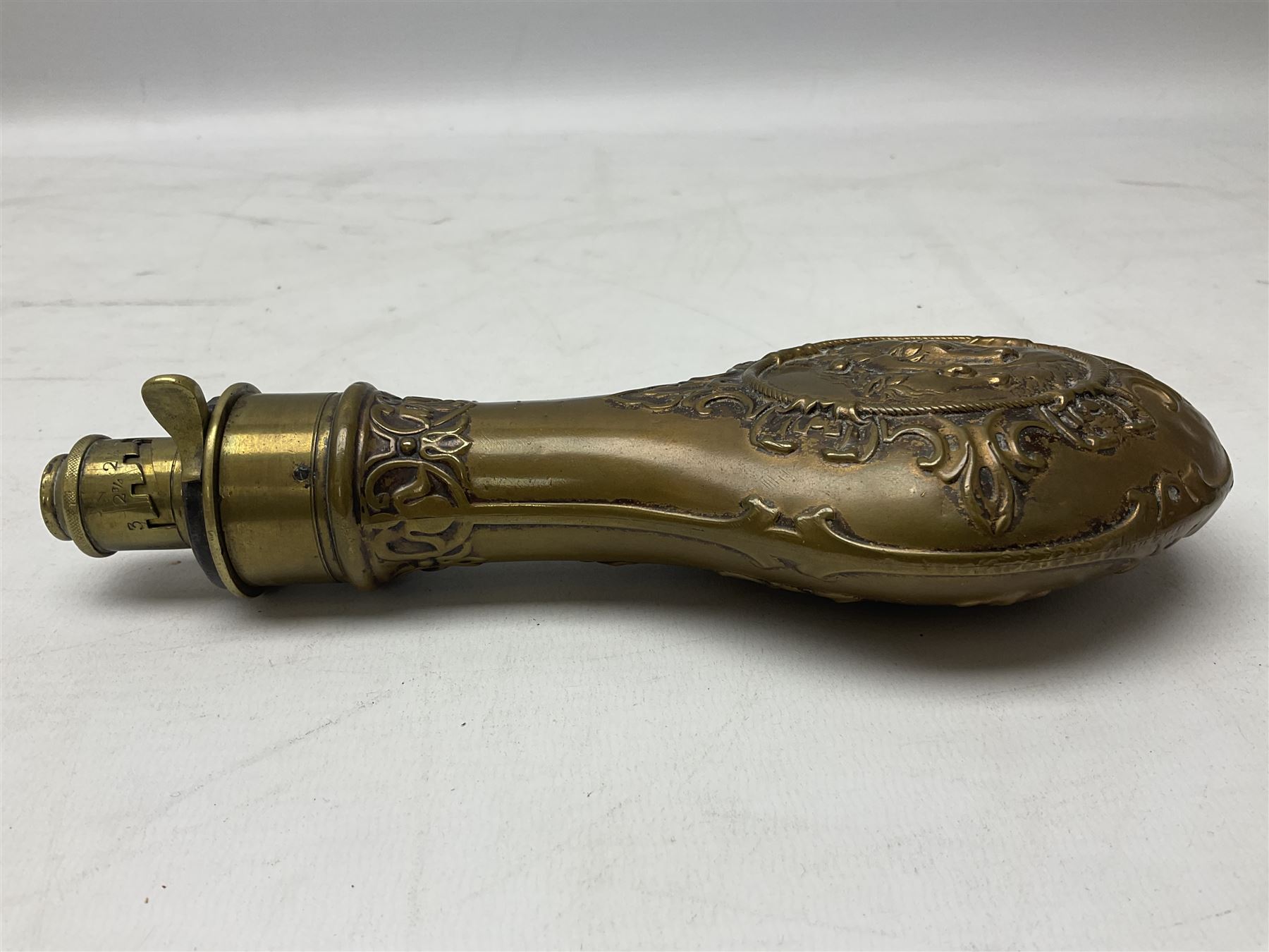 Copper and brass powder flask by G. & J.W. Hawksley Sheffield with embossed panel of 'Pharaohs Horses' to one side H21cm