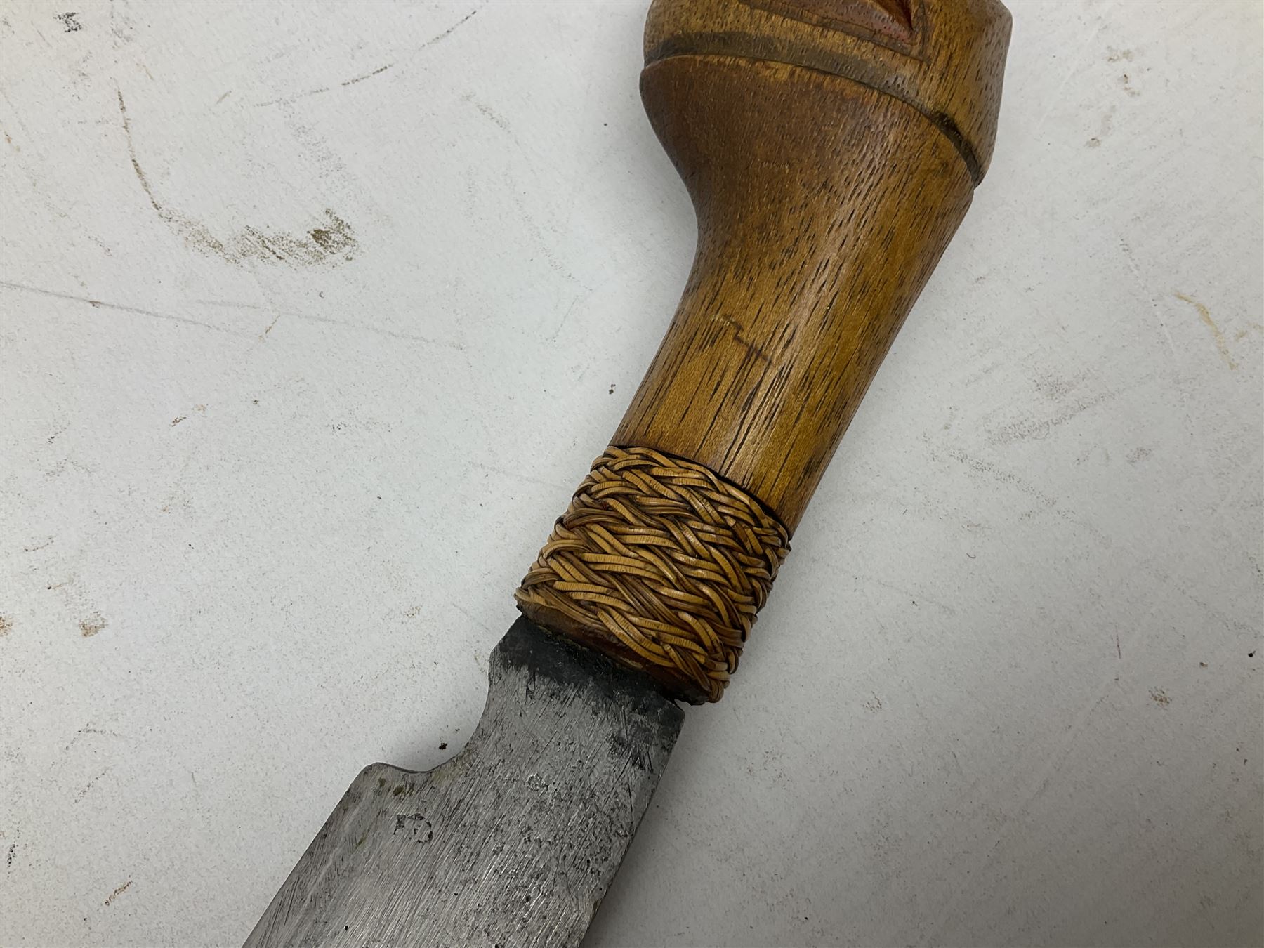 Malaysian parang survival knife the 29cm steel blade with character marks, cane bound teak grip carved with a stylised turtle head to the pommel, with matching teak scabbard L46cm overall