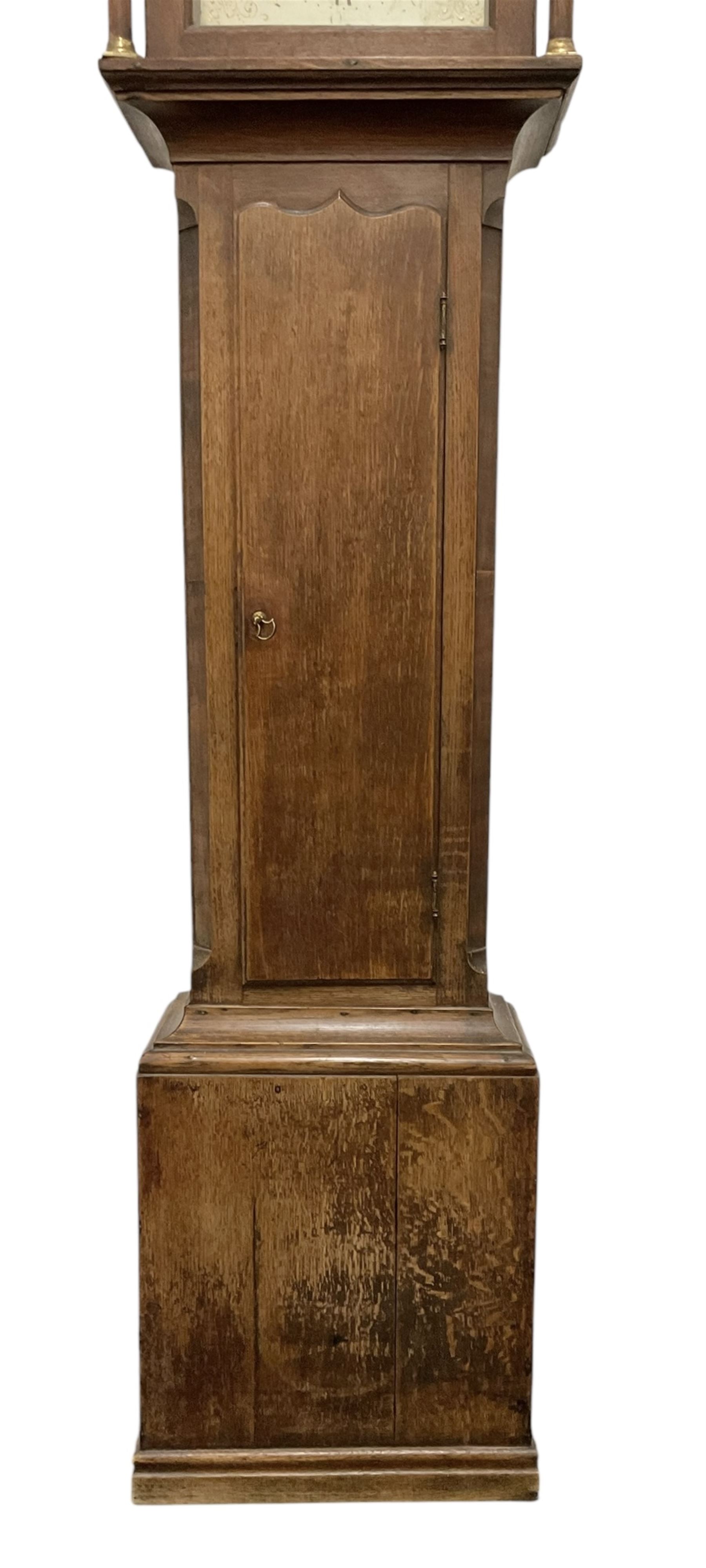 Early 19th century- 30hr oak longcase clock with a swan necked pediment and break arch hood door, trunk with canted corners and a long wavy topped door, on a rectangular plinth with applied skirting, painted dial with gold painted rococo spandrels to the corners and arch, Roman numerals and steel hands, makers name indistinct but retailed in Guisborough, with a rope driven countwheel striking movement, striking the hours on a bell. With weight and pendulum.