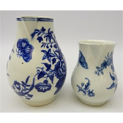  Worcester blue and white sparrow beak jug circa 1770-75, decorated with butterflies amongst flowers, H11cm and another matching smaller jug (2)  