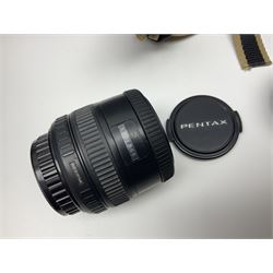 Four camera bodies, to include, Ricoh KR-10 serial no. 38826, Pentax MZ-M serial no. 4185969 with 'SMC Pentax- M 1:3.5 28mm' lens, Canon EOS500 serial no. 080927, with 'Sigma Zoom 100-300mm 1:4.5-6.7 DL'  lens etc, with other camera lenses and equipment 