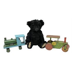 1991 Atlantic Bears limited edition black teddy bear, the revolving head with applied eyes, vertically stitched nose and jointed limbs with growler mechanism No.84/100 H53cm; together with clockwork tin-plate road roller possibly by Mettoy and a push-along painted scratch built wooden locomotive (3)
