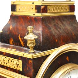 French-late 19th century brown stained 8-day faux Tortoise shell and ormolu mounted mantle clock, rectangular case with glazed side panels and shaped pediment with matching finials, convex enamel dial with Roman numerals, minute track and steel moon hands within a cast brass glazed dial bezel,
twin barrel movement with rack striking, striking the hours and half hour on a coiled gong. With pendulum and key.