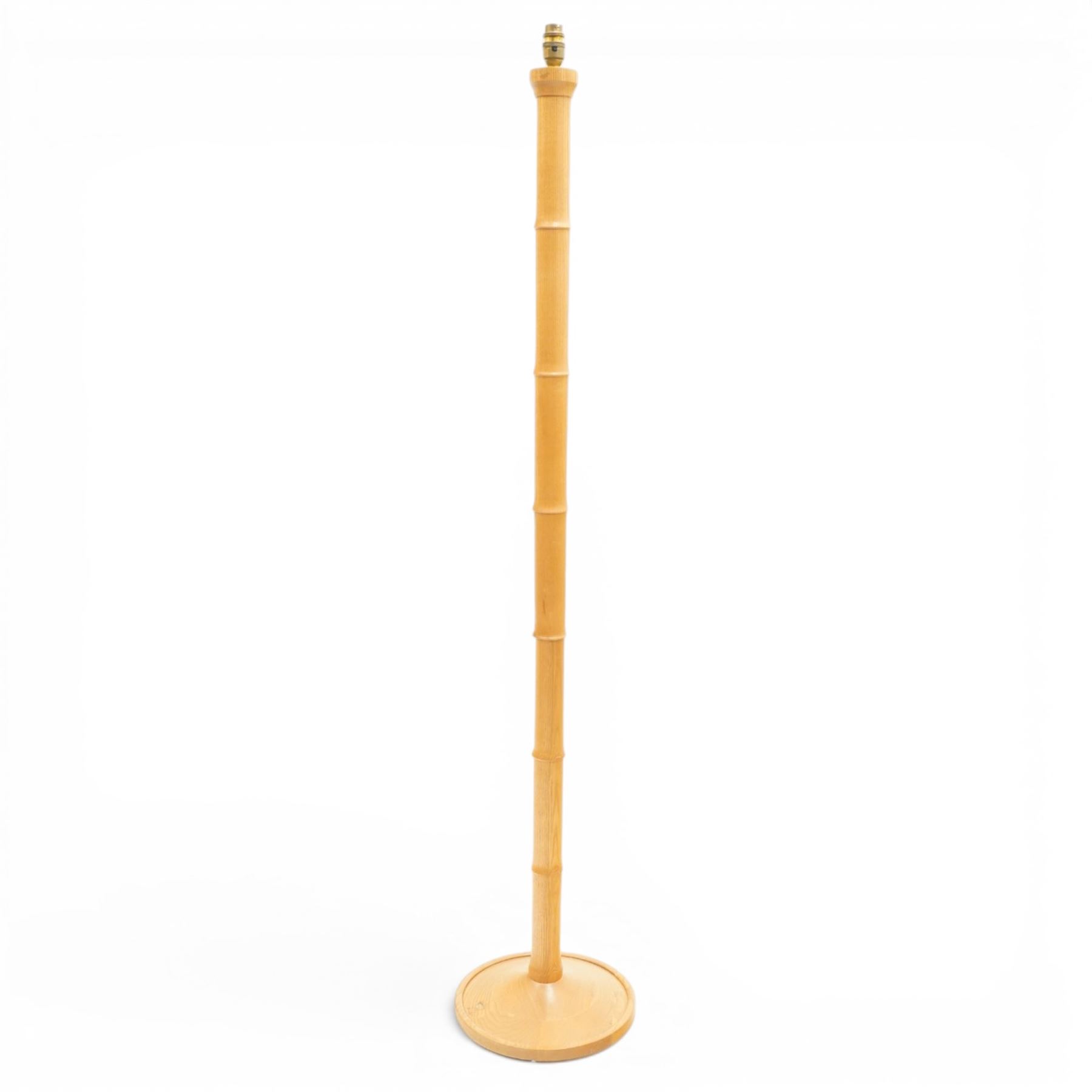 Treske - ash standard lamp, brass light fitting, turned column, on a circular base 