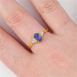 14ct gold Ceylon sapphire and diamond ring, single radiant cut sapphire of approx 0.75 carat, with three round brilliant cut diamonds set either side, stamped