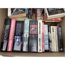 Large collection of hardback and paperback books, mainly military books, to include Band of Brothers, Dawn of D-Day, Dessert Warrior, Book of the Somme, Battle of Britain, etc in four boxes  