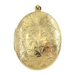 9ct gold oval locket with engraved decoration, Birmingham 1971, approx 18.7gm