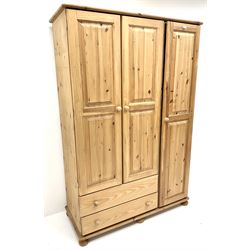 Solid pine triple combination wardrobe, three cupboards, two drawers, turned supports 