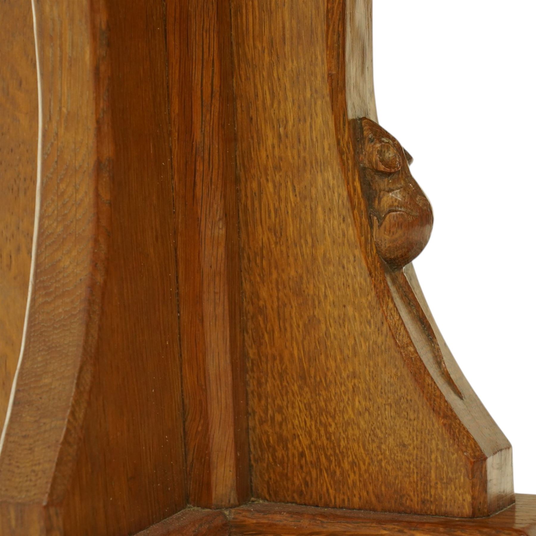 Mouseman - 1950s oak coffee table, octagonal adzed top on cruciform base and sledge feet, carved with mouse signature, dated 1956 and engraved 'Sylvia' to the top edge, by Ken Almack of the workshop of Robert Thompson, Kilburn

Notes:
Made by Ken Almack at the Robert Thompson workshop, Kilburn, where he trained and worked as a Mouseman craftsman; brother of Colin ‘Beaverman’ Almack, who later established his own workshop. The table was made for Sylvia to mark their engagement in 1956, prior to their marriage in 1957.

Provenance: The estate of Ken Almack; Tennants Auctioneers, 20th Century Design, 5 October 2024.