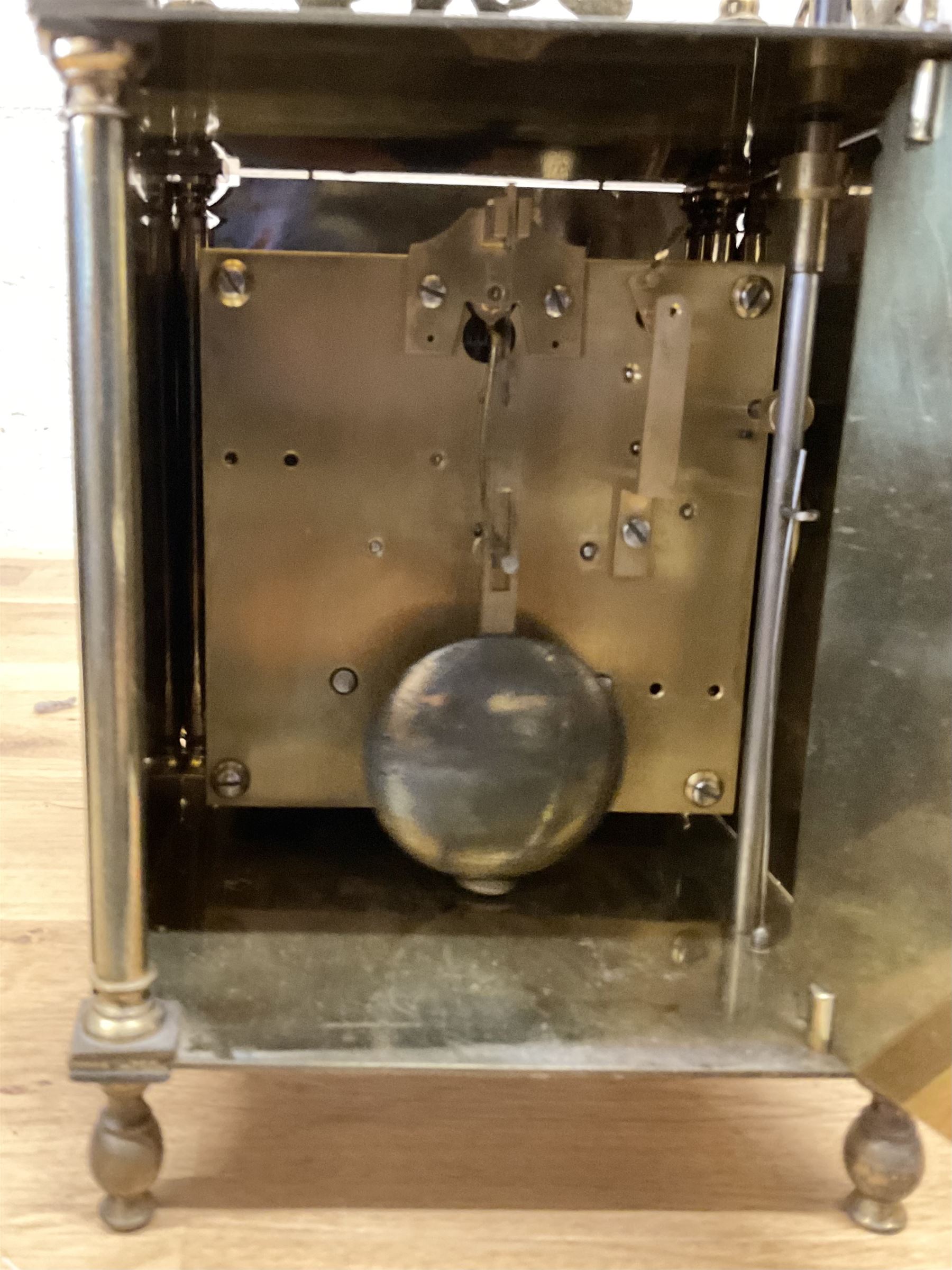 English - 20th century 8-day lantern clock in period 18th century style, square brass case surmounted by a domed bell, with a brass chapter, engraved dial centre and stylised period steel hands, with a two train spring driven movement striking the hours and half hours on a bell. With pendulum. 