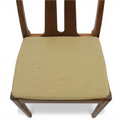 Nathan - teak drop leaf dining table and four Nathan dining chairs, the rectangular top with rounded corners fitted with twin hinged drop leaves and gate legs, extended to form an oval table 174cm in length, raised on square section supports united by stretchers, the chairs with teak frames and padded beige upholstered seat (H 96cm, W 48cm)