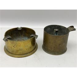 Trench Art - three WW2 brass shell case ashtrays, one mounted with Royal Artillery cap badge and button and one mounted with RA button; together with a pair of place name holders each formed from a Royal Artillery cap badge (5)
