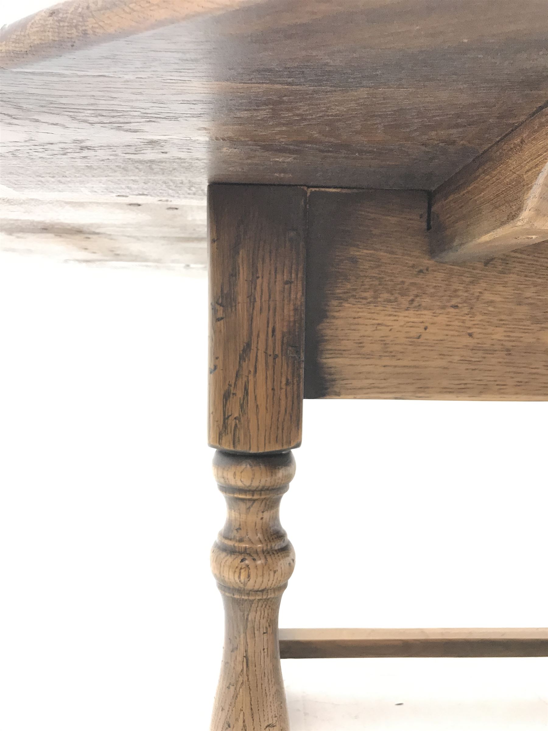 17th century style oval distressed light oak plank top dining table, rectangular stretcher base, L228cm, W150cm, H77cm