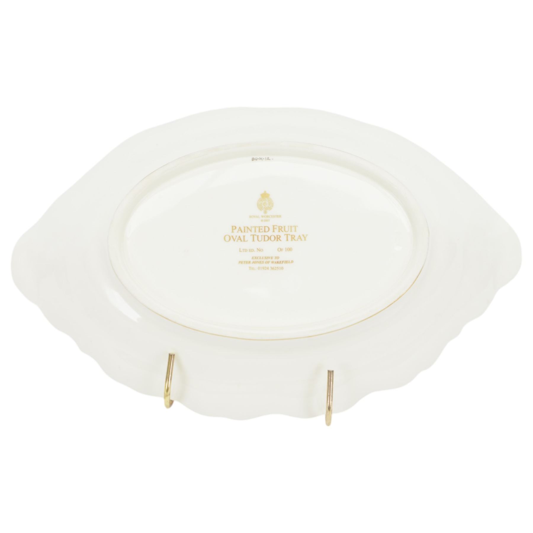 Late 20th century Royal Worcester dish, of oval form with gilt shaped rim and twin shell handles, hand painted by Jason Bowman with still life of fruit upon mossy ground, signed J Bowman, wit marks beneath, with makers fitted card box


