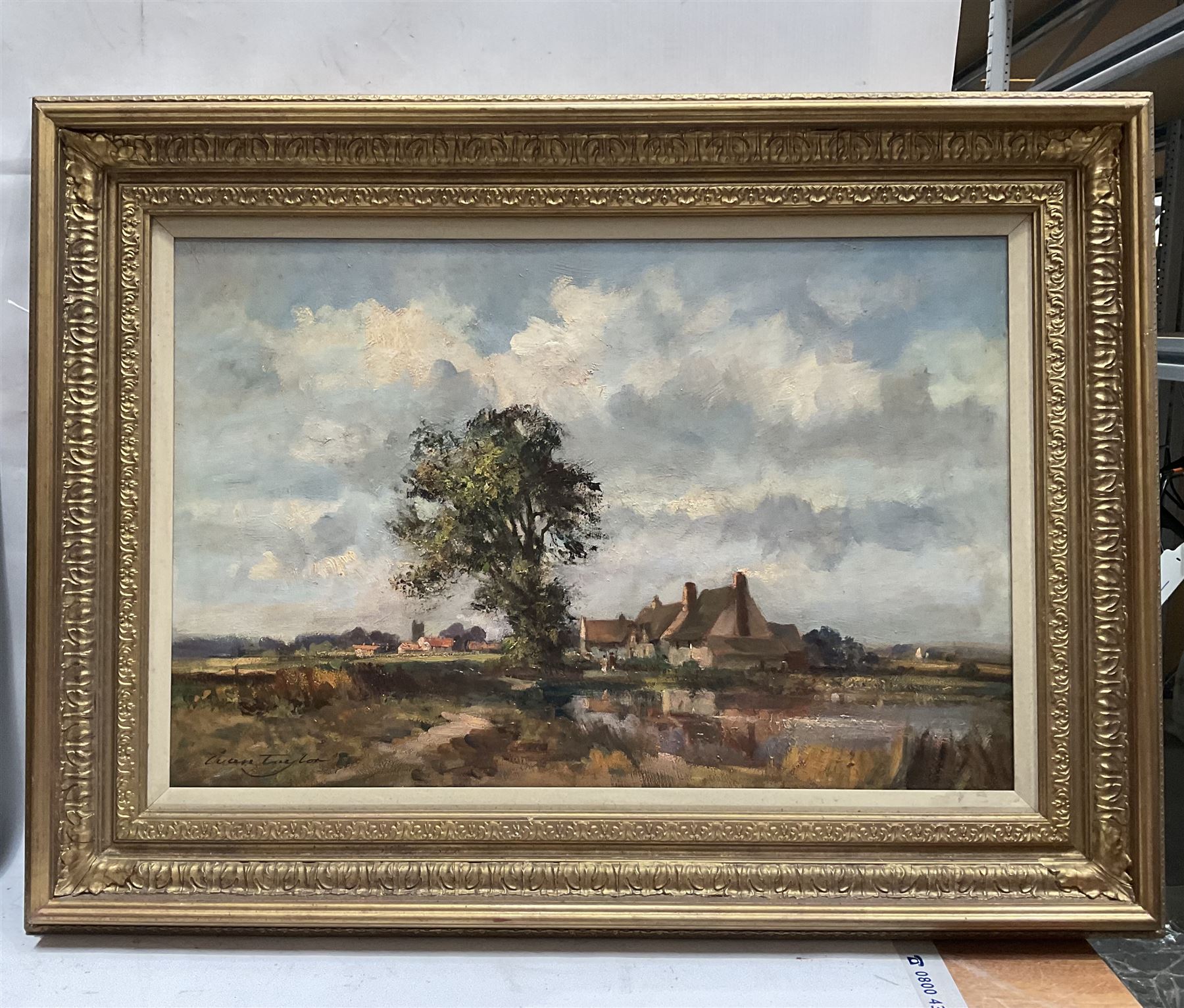 Ivan Taylor (British 1946-): Fields and Town Church, oil on canvas signed 49cm x 74cm 