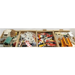 Scalextric - large quantity of unboxed trackside accessories including various buildings, tiered spectator stands, balustrading, fences, crash barriers, figures, event board etc, in four boxes