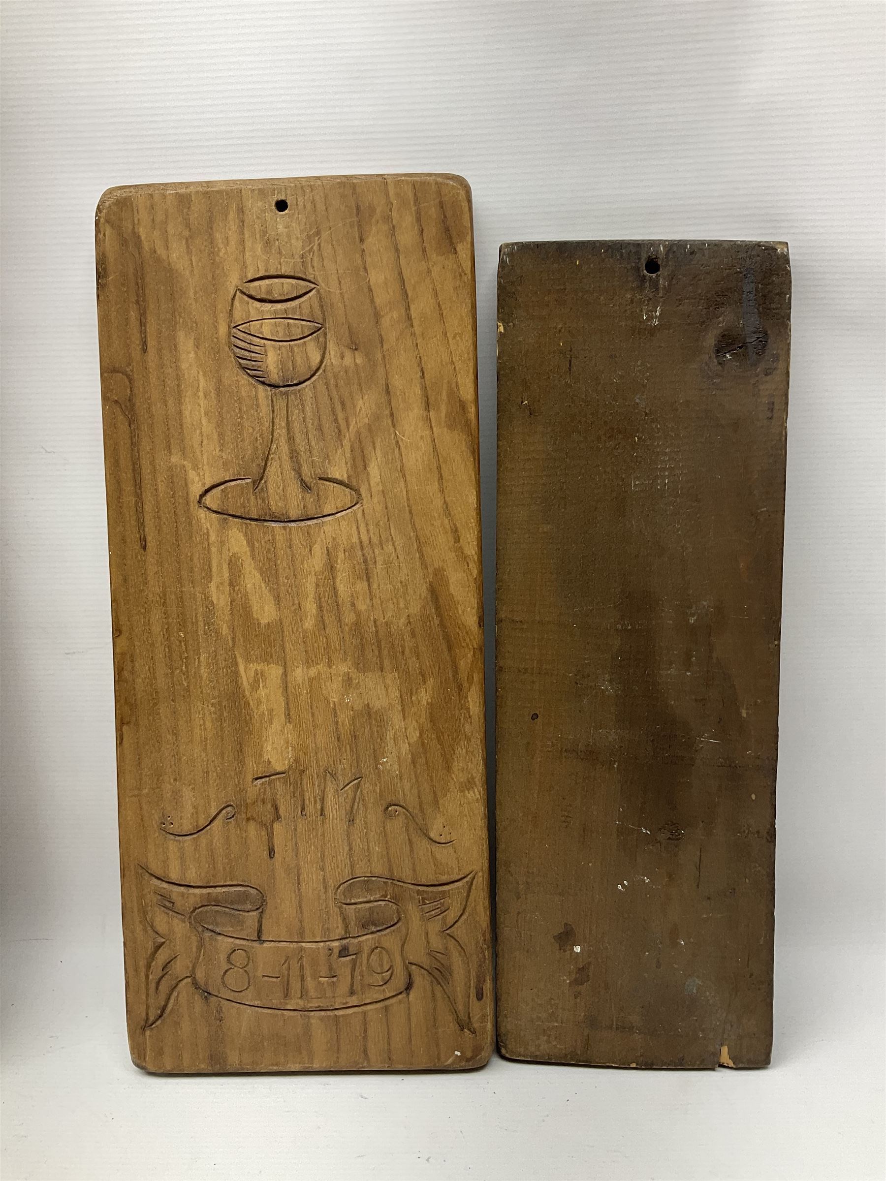 Eight 20th century hardwood Dutch folk art Speculaasplank or biscuit moulds, most examples typically carved with figures in traditional dress, tallest H60cm