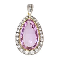 18ct gold Brazilian pink topaz and round brilliant cut diamond pendant, the milgrain set pear cut topaz of 8.80 carat, with graduating diamond surround and diamond set bail