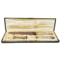 French two piece silver handled carving set, the handles with foliate decoration, marks indistinct, probably Minerva guarantee mark and makers mark, the knife blade stamped Paris, contained within a fitted case