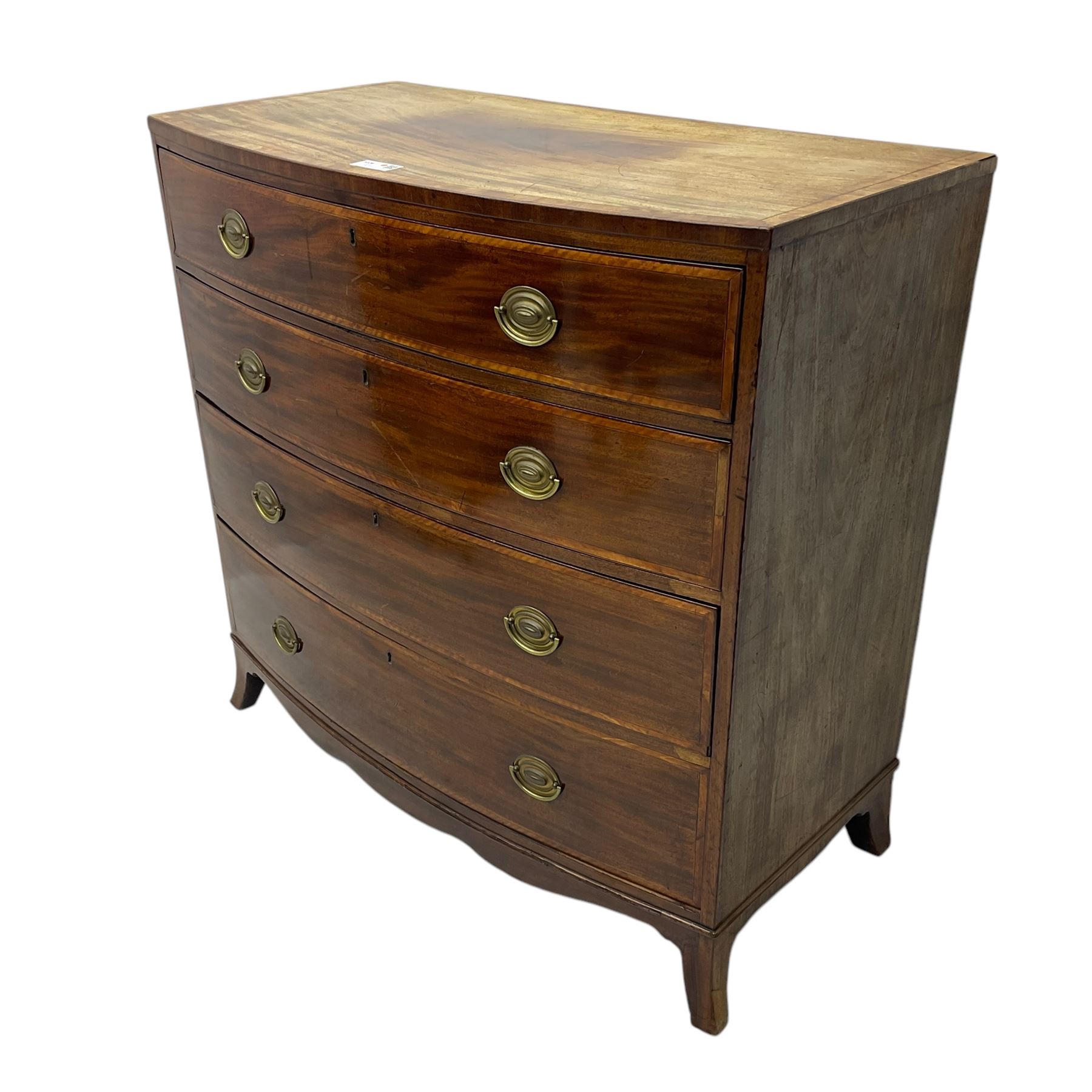 George III mahogany bow-front chest of drawers, four graduated drawers with oval brass handles, raised on splayed bracket feet with a shaped apron