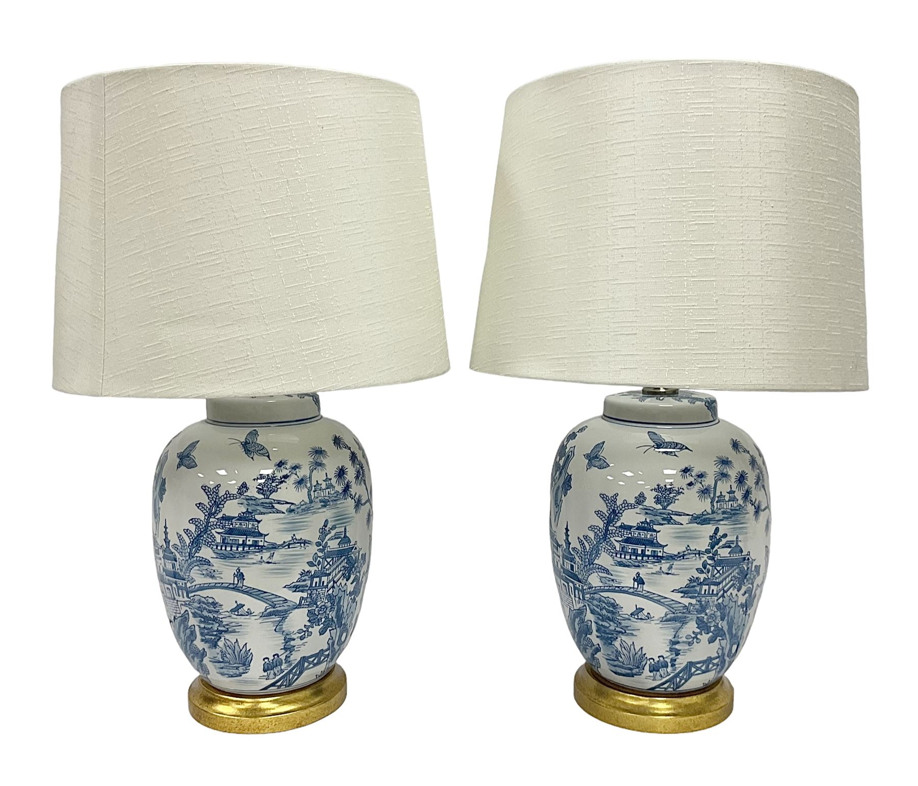 Pair of Chinese table lamps of baluster form, each decorated with landscape scene, raised upon gilt circular base, including shade H63cm